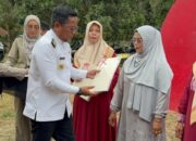 Sertifikat Redistribusi Tanah 2025 Diserahkan di Pelalawan: Apa Pesan Bupati Zukri ke Warga?