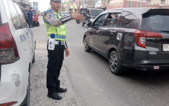 Pastikan Arus Lalu Lintas Kondusif, Sat Lantas Polres Batu Bara Kawal Titik Padat Jalinsum Indrapura