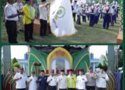 Sekda Ketapang, Repalianto, secara resmi melepas Pawai Ta’aruf yang ditandai dengan pengangkatan bendera