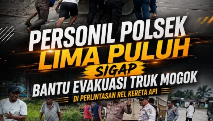 Aksi Sigap Personel Polsek Lima Puluh Evakuasi Truk Mogok di Perlintasan Rel Kereta Api
