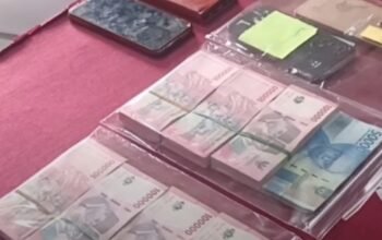 “28 Kepala Sekolah Banyuasin Terjaring OTT Polda Sumsel, Dugaan Setoran Dana Revitalisasi Terbongkar” gedung perkantoran dan penyelidikan kasus hukum oleh kepolisian.